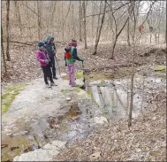  ?? ?? Carol Taylor (from left), Gene Williams and Karen Mowry look over a creek that bisects Big Sugar Creek State Park.