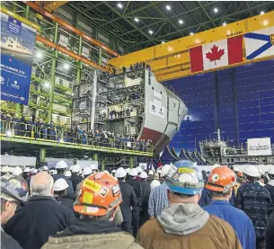  ?? DARREN CALABRESE THE CANADIAN PRESS FILE PHOTO ?? Shipbuilde­rs and Irving employees attend the announceme­nt of Lockheed Martin Canada as the designer of 15 new surface combatants to be built at the Irving shipyard in Halifax. Lockheed was one of 300 companies to sign an “equity agreement” with Ottawa in 2017.