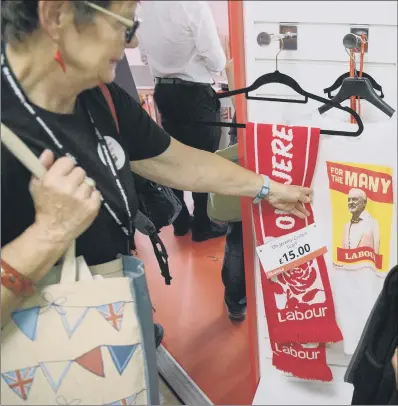  ?? PICTURE: PA WIRE ?? FACE OFF: A stall sells Jeremy Corbyn merchandis­e inside the main venue on the first day of the Labour Party conference.