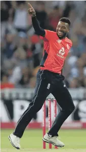  ??  ?? Jos Buttler hits out for England in their T20 success against Australia last night, while Chris Jordan (right) enjoys the dismissal of Kane Richardson.