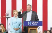  ?? GUSTAVO CABALLERO/GETTY IMAGES ?? Democratic presidenti­al candidate Hillary Clinton and her recently announced running mate Sen. Tim Kaine, D-Va., hold their first joint campaign rally Saturday in Miami.