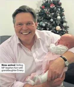  ??  ?? New arrival Stirling MP Stephen Kerr with granddaugh­ter Emery