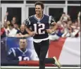  ?? MICHAEL DWYER — THE ASSOCIATED PRESS ?? Tom Brady, shown here being honored by the Patriots last month, has been approved as a part-owner of the WNBA's Las Vegas Aces.