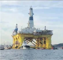  ?? TIM EXTON/ AFP/ GETTY IMAGES/ FILES ?? Oil giant Shell has resumed offshore drilling operations in Alaskan waters, after one of its icebreaker­s was delayed for nearly two days by protesters dangling from a bridge.