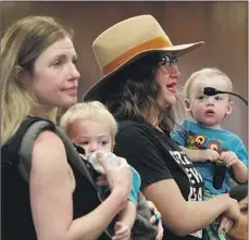  ?? Al Seib Los Angeles Times BY SAMMY ROTH ?? CLIMATE activists Carolina Forni, left, and Emily Spokes address the LADWP board meeting about its power plant plans.