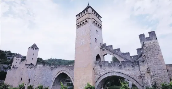  ?? PHOTOS: JIM BYERS ?? Pont Velantré is a stunning stone bridge in Cahors, France, an Instagram-worthy city that attracts outdoor enthusiast­s, as well as wine lovers and foodies.