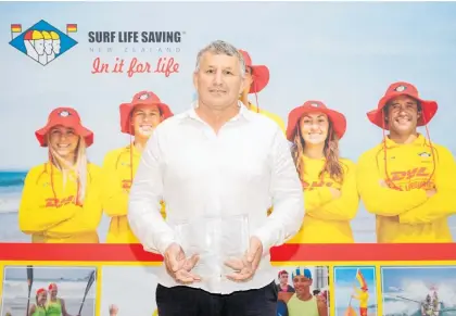  ?? Photo / SLSNZ ?? Pukehina Surf Rescue chairman Boyd Harris with his national Lifeguard of the Year award.