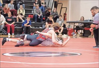  ?? Tim Godbee ?? The Sonoravill­e High School wrestling team, shown here in action against Calhoun last week, is off to a 4-0 start this winter.