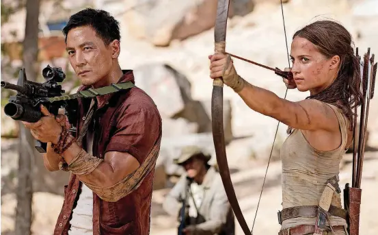  ?? [PHOTO PROVIDED BY ILZE KITSHOFF, WARNER BROS. PICTURES/METRO-GOLDWYN-MAYER PICTURES] ?? Daniel Wu stars as Lu Ren and Alicia Vikander as Lara Croft in “Tomb Raider.”