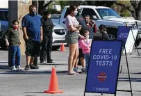  ?? Jerry Lara / Staff photograph­er ?? Families waited in line in November to get a COVID-19 test.