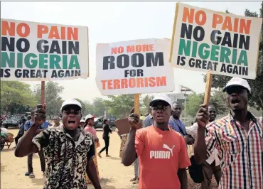  ?? PHOTO: REUTERS ?? People during a rally to show support for Nigeria’s President Muhammadu Buhari in Abuja, Nigeria, on Monday.