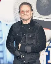  ?? RICHARD SHOTWELL/INVISION ?? The long-rumored memoir by U2 frontman Bono, who is seen Dec. 12, is titled “Surrender.”