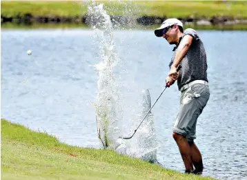  ?? Associated Press ?? ■ Parker McLachlin hits from the water on the 18th fairway during the third round of the St. Jude Classic golf tournament Saturday in Memphis, Tenn.