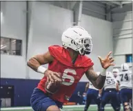  ?? Brendan Hill / UConn / Contribute­d photo ?? UConn quarterbac­k Ta’Quan Roberson participat­es in practice Thursday.