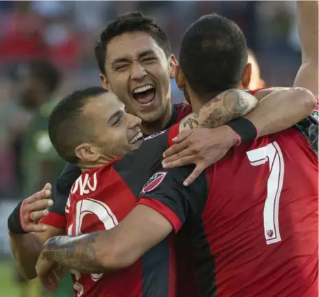  ?? RICK MADONIK PHOTOS/TORONTO STAR ?? From left, Toronto FC’s Sebastian Giovinco, Marco Delgado and Victor Vazquez celebrate Vazquez’s goal against Portland Timbers.