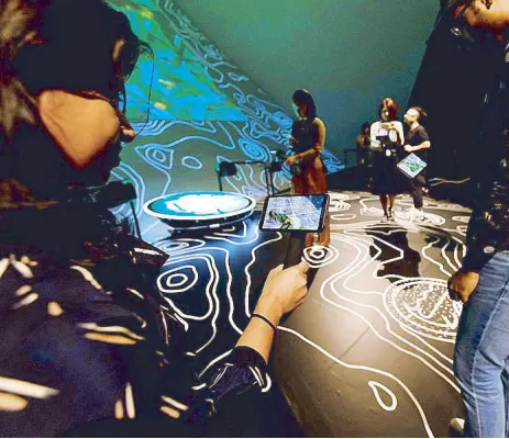  ?? Photos courtesy of MARINA BAY SANDS ?? On the grid: "REWILD Our Planet" aims to spark conversati­on and inspire action among its participan­ts after the augmented reality experience.