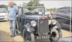  ?? ?? Phil Gent with his 1938 Austin 7 Opel Tourer and a photo of Stirling Moss and Patrick Stewart