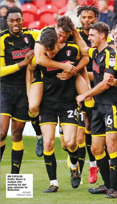  ?? PICTURES: PSI/Simon Davies ?? MR POPULAR: Kieffer Moore is mobbed after notching his lastgasp equaliser for Rotherham