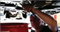  ?? U.S. AIR FORCE PHOTO BY AIRMAN RHETT ISBELL ?? Thomas Johnson, 19th Force Support Squadron Auto Hobby Shop lead mechanic, drains the oil of a car June 9 at the Little Rock Air Force Base. Johnson said oil changes and brake problems are the most common issues customers come in with.