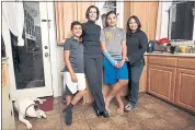  ?? DAN COYRO — SANTA CRUZ SENTINEL ?? Kimberly Petersen is flanked by her two sons, Chase and Cade, and her partner Lupita Alaniz.