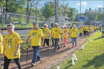  ?? KIRK STARRATT ?? Cancer survivors make a lap around the ballfield at Memorial Park as part of the 12th annual Kentville Relay For Life.