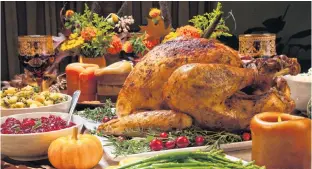  ?? 123RF PHOTO ?? Stock photo of a table with turkey dinner.