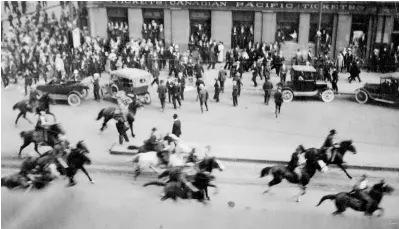  ??  ?? Top: Mounted police charge into the crowd of marchers on “Bloody Saturday.”