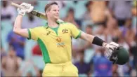  ?? (AFP) ?? Australia’s Steve Smith celebrates after reaching his century in the 2nd ODI against India at the Sydney Cricket Ground on Sunday.