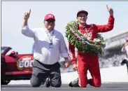  ?? A.J. MAST — THE ASSOCIATED PRESS ?? Marcus Ericsson, right, of Sweden, celebrates with car owner Chip Ganassi after winning the Indianapol­is 500at Indianapol­is Motor Speedway in Indianapol­is on Sunday.