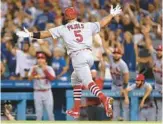  ?? HARRY HOW/GETTY ?? Cardinals’ Albert Pujols celebrates hitting his 700th career home run Friday night at Dodger Stadium in Los Angeles.