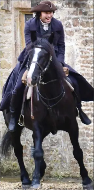  ??  ?? Hold on tight! Aidan Turner during filming for the third series this week