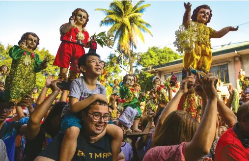  ??  ?? DEVOTEES carry their religious icons of Santo Nino (holy child) to be blessed by priests during the annual festival in Manila. The Philippine­s is Asia’s bastion of Catholicis­m and Santo Nino is one among dozens of religious festivals honouring various saints and religious icons, a legacy of three centuries of Spanish rule across the archipelag­o. AFP PHOTO