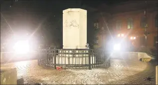  ?? Karl Merton Ferron / TNS ?? Remains of the Christophe­r Columbus statue in Baltimore after it was ripped from its pedestal and dragged into the Jones Falls by protesters on Saturday.