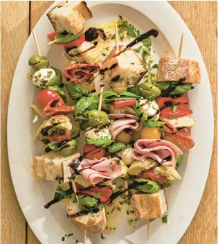  ?? ANDREW BUI/TNS ?? Antipasto platters are often served as a shared first course or appetizer before a main meal.