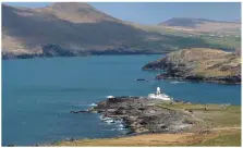  ??  ?? Valentia lighthouse with the beautiful scenery in the background.