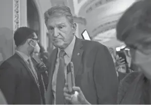  ?? PHOTOS BY J. SCOTT APPLEWHITE/AP ?? It was unclear is Democrats would be able to win over Sen. Joe Manchin, D-W.VA., without decisive interventi­on by the president.