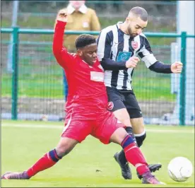  ?? Picture: Matthew Walker FM4688418 Buy this picture from kentonline.co.uk ?? K Sports’ Ed Morant is challenged by a Lewisham Borough player (red) on Saturday