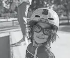  ?? PHOTOS BY GAELEN MORSE/COLUMBUS DISPATCH ?? Sora Chamberlai­n takes a break from skateboard­ing at Adventure Park.