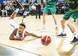  ??  ?? Calvin Abueva of Gilas Pilipinas dives to the floor during the second half of Thursday’s FIBA World Cup qualifiers match against Australia in Melbourne. The Aussies won, 84-68. (FIBA.com)