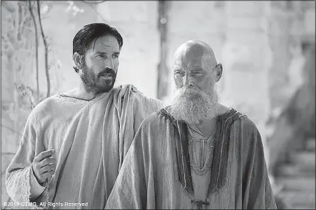  ?? AP/PHILIPPE ANTONELLO ?? Jim Caviezel (left), who portrayed Jesus Christ in the 2004 movie The Passion of the Christ, appears in Paul, Apostle of Christ, which debuted Friday. In an attempt to draw larger audiences to Christian-theme movies that no longer stand out as a...