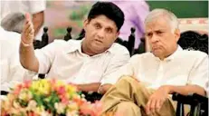  ??  ?? FOR THE GOOD TIMES: Before the break up, UNP leader Ranil Wickremesi­nghe patiently gives ear to deputy leader Sajith Premadasa as he outlines his plans for the party’s future