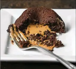  ?? PHOTO BY GORAN KOSANOVIC FOR THE WASHINGTON POST ?? Molten Peanut Butter Chocolate Cake.