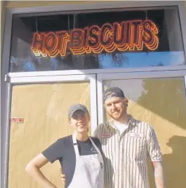  ?? AMY DREW THOMPSON/COURTESY PHOTO ?? Mary and Neil Westfall of Winter Park Biscuit Co. Their stall at Orlando’s East End Market opened in November of 2020.