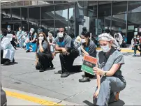  ??  ?? Team members gather Friday in front of Advocate Christ Medical Center in Oak Lawn to kneel in memory of George Floyd.