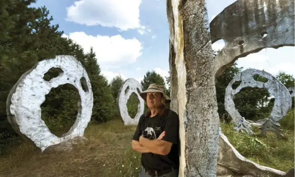  ?? KEITH BEATY PHOTOS/TORONTO STAR ?? Retired high school art teacher Peter Camani created 27 screaming heads in a clearing where he originally planned to build his castle, which includes a screaming head turret.