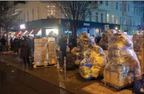  ?? (AP/dpa/Paul Zinken) ?? Relief supplies for earthquake victims in Turkey and Syria stand packed in Berlin, Germany on Monday. Members of the Turkish community in Berlin collected tons of relief supplies within a few hours.