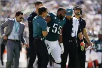  ?? MATT SLOCUM - THE ASSOCIATED PRESS ?? Eagles defensive end Brandon Graham, center, walks off after being injured against the San Francisco 49ers during the first half Sunday at Lincoln Financial Field. It appears Graham is finished for the season.