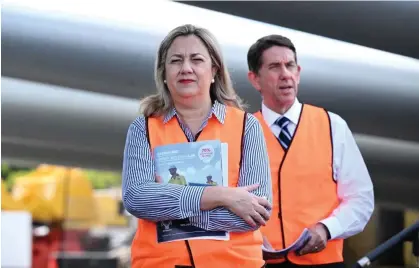  ?? Photograph: Darren England/AAP ?? Queensland premier Annastacia Palaszczuk and treasurer Cameron Dick. The state’s bottom line has swelled thanks to higher coal royalties.