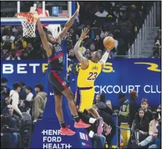  ?? Associated Press ?? Lakers forward LeBron James (23) shoots over the defense of Detroit Pistons center Isaiah Stewart (28) during the first half, Wednesday, in Detroit. The Lakers won 133107 to hand the Pistons their 15th straight loss.