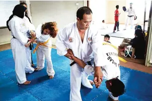  ??  ?? Students during a training session in the ancient Indonesian martial art of ‘pencak silat’ in Jakarta.